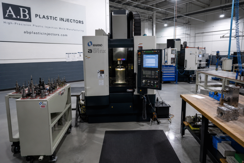 A clean, well-organized workshop of a small-to-medium-sized injection molding company